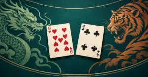 Hjärter nio och klöver fyra ligger på ett mörkgrönt spelbord mellan en illustrerad drake och tiger som symboliserar de två sidorna i Dragon Tiger.